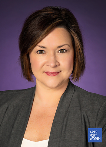 Headshot of Dean Amy Hardison Tully with a purple backdrop.