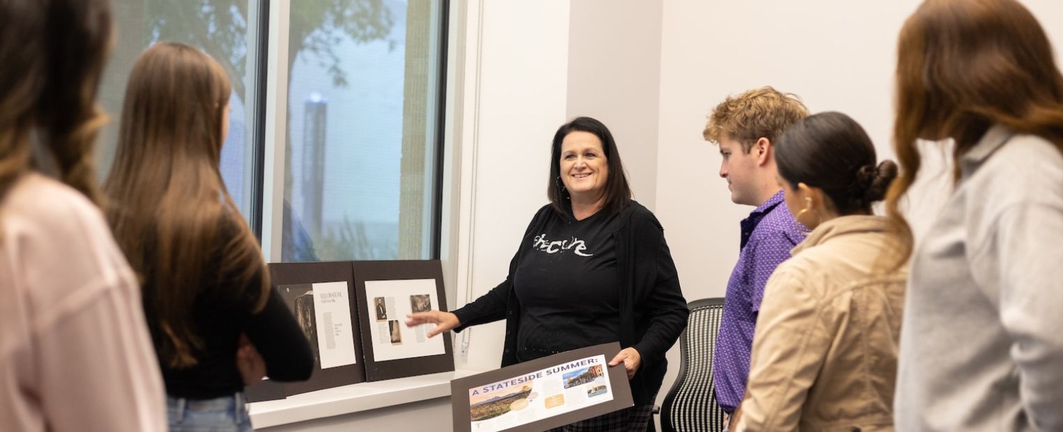 Rhonda Schaller teaches her graphic design class in the computer lab.
