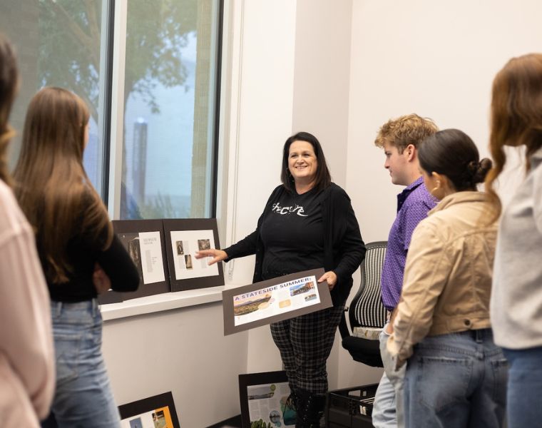 Rhonda Schaller teaches her graphic design class in the computer lab.
