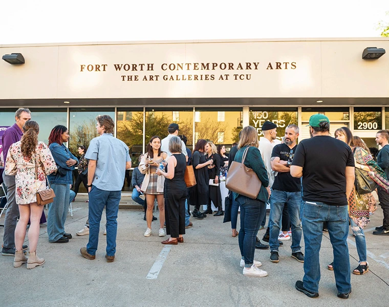 A small crowd gathers outside of the Fort Worth Contemporary Arts gallery