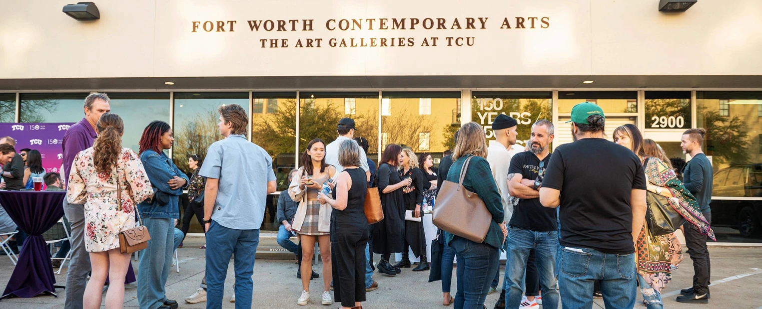 A small crowd gathers outside of the Fort Worth Contemporary Arts gallery