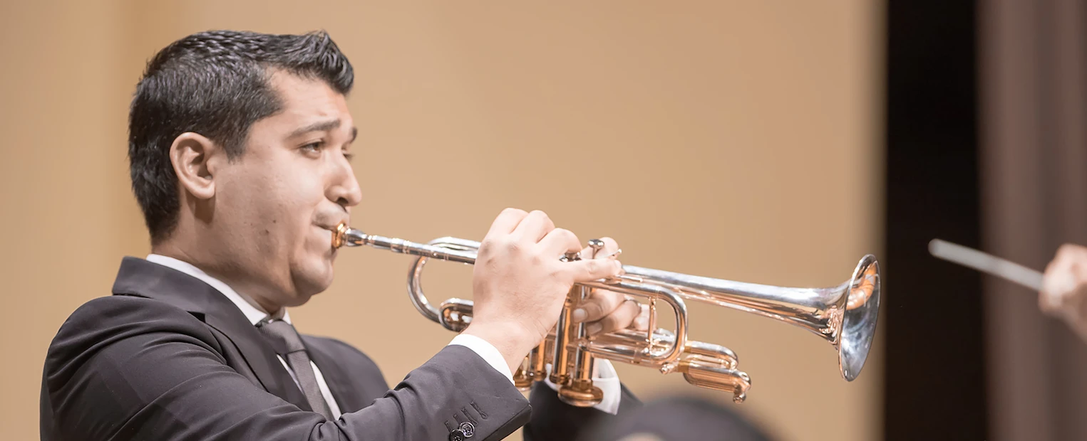 Pacho Flores plays a silver trumpet during the Latin American Music Festival